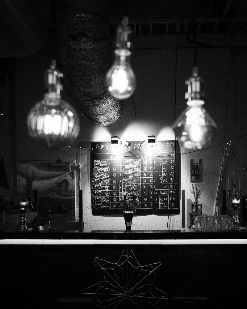 black and white photograph of the bar in qvenbrygg's taproom.
